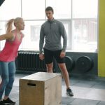 Woman performing a box jump for bone-strengthening exercise