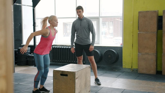 Woman performing a box jump for bone-strengthening exercise