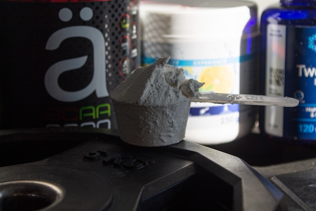 Sports supplements and powder scoop for performance training